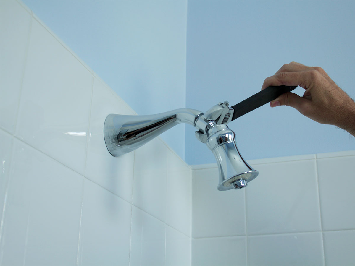 Remove mineral deposits from shower heads & faucets
